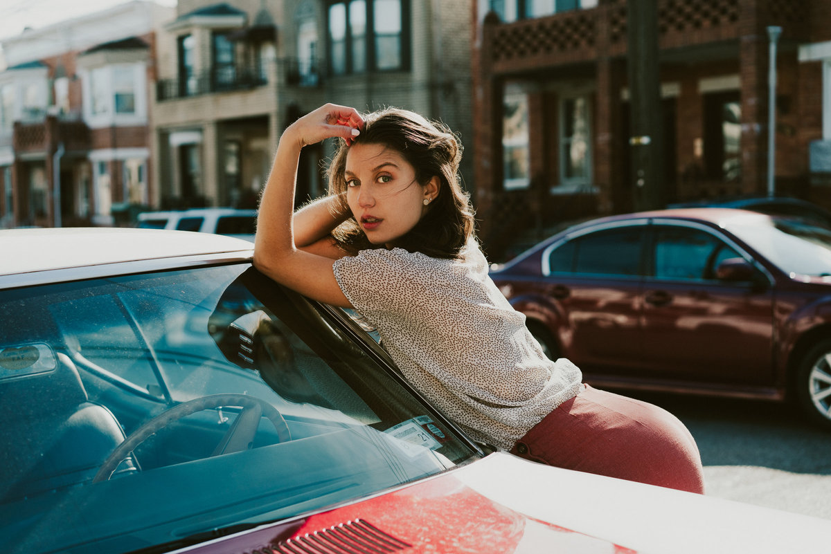 PORTRAIT OF A GIRL IN BROOKLYN WITH AN OLD CAR