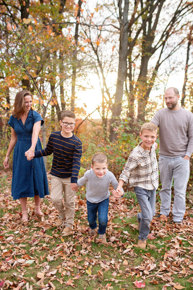 Family session located outside in the woods