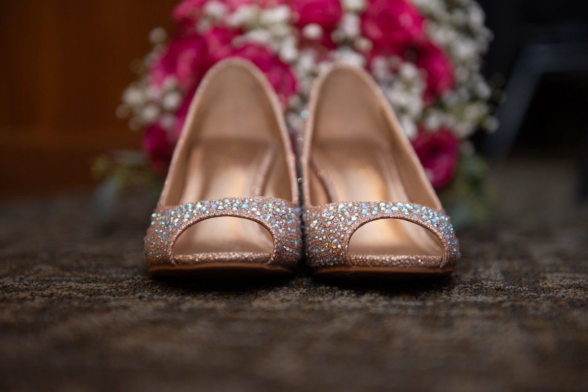 sparkling shoes with bouquet in back