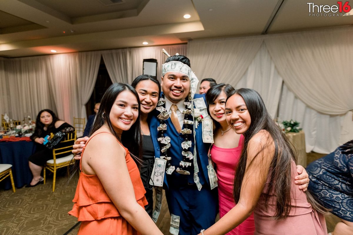 Girls surround the Groom during the Money Dance