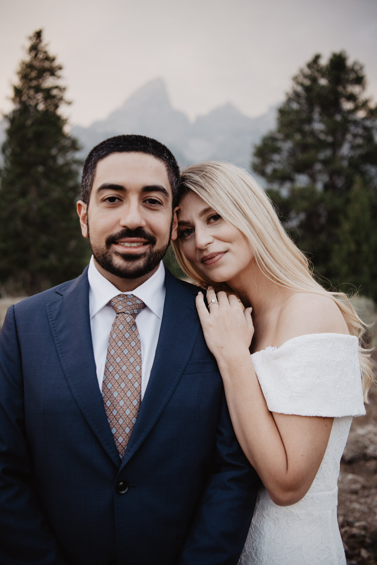 Photographers Jackson Hole capture bride and groom cozy photos