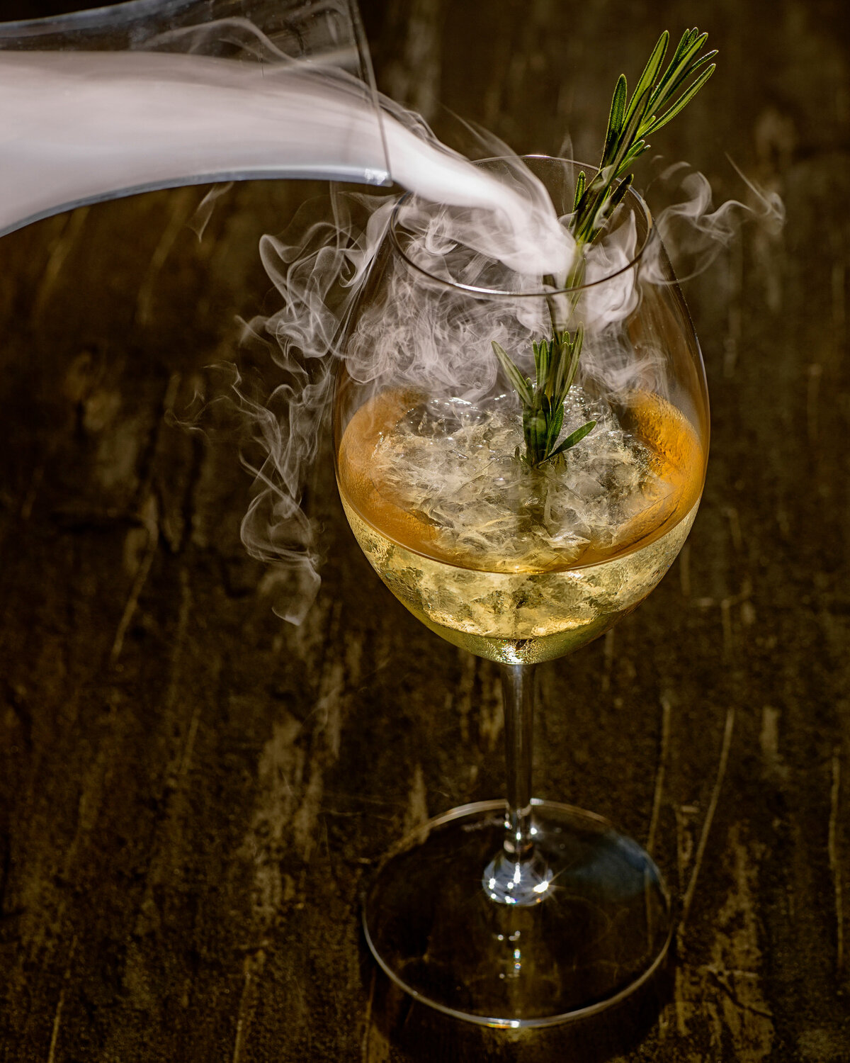 Smoke being poured into a wine glass