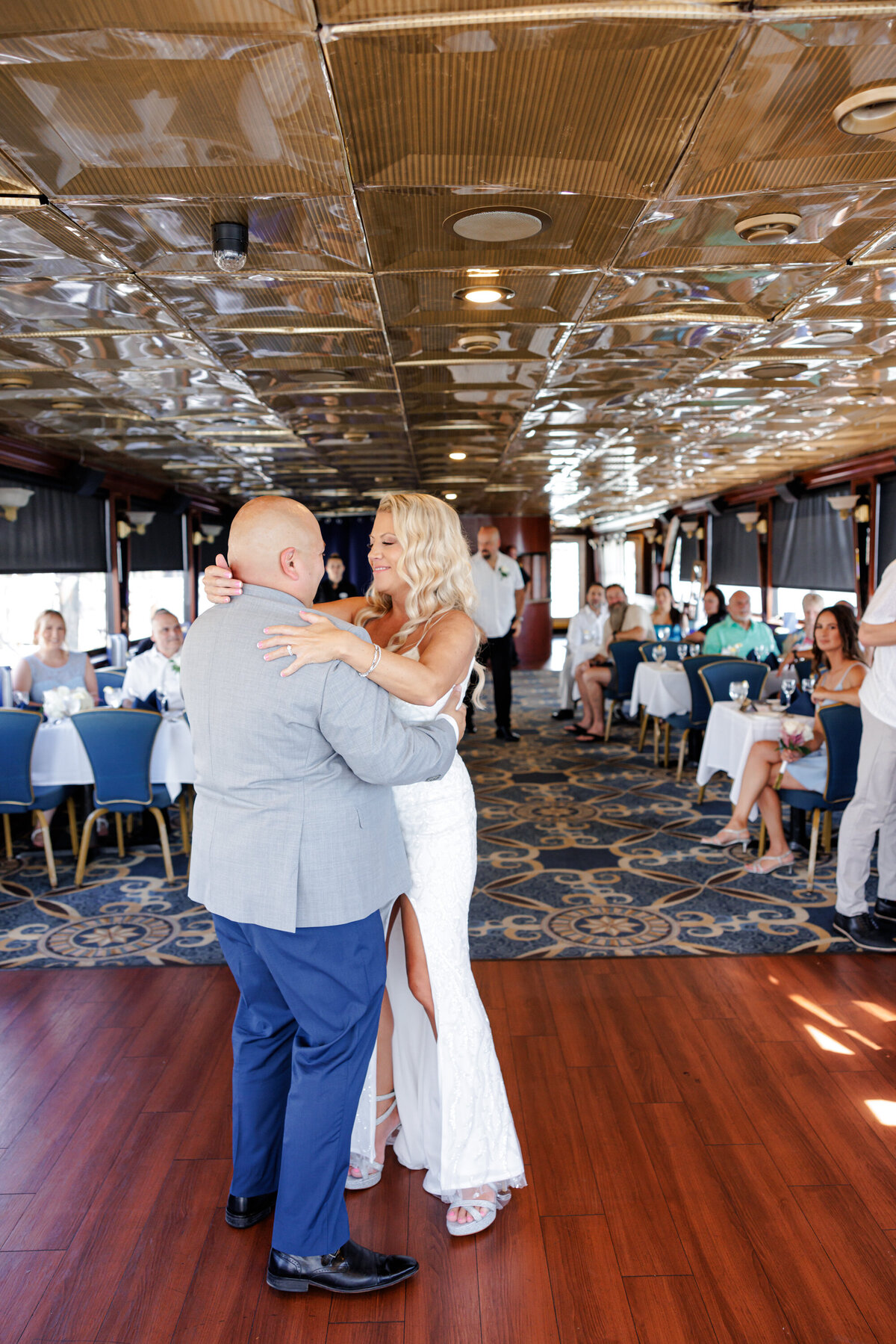 Laughter and dancing at small Florida yacht wedding celebration.