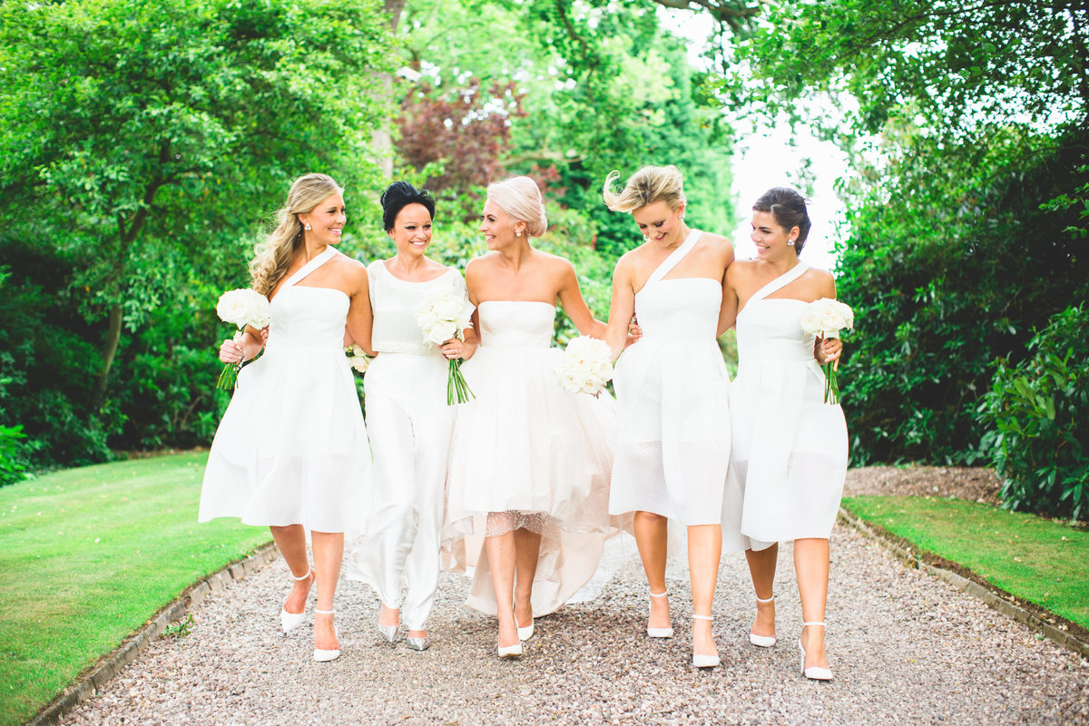 bridesmaids walking laughing