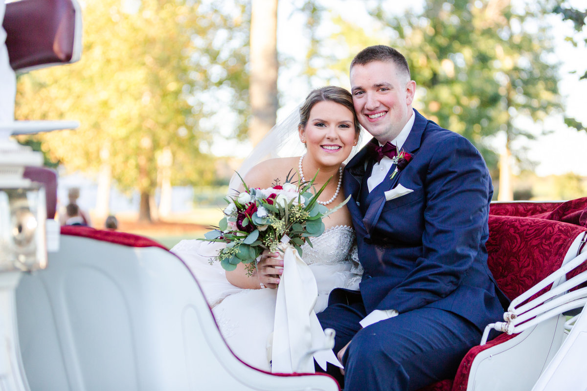 Bride and groom in horse carriage