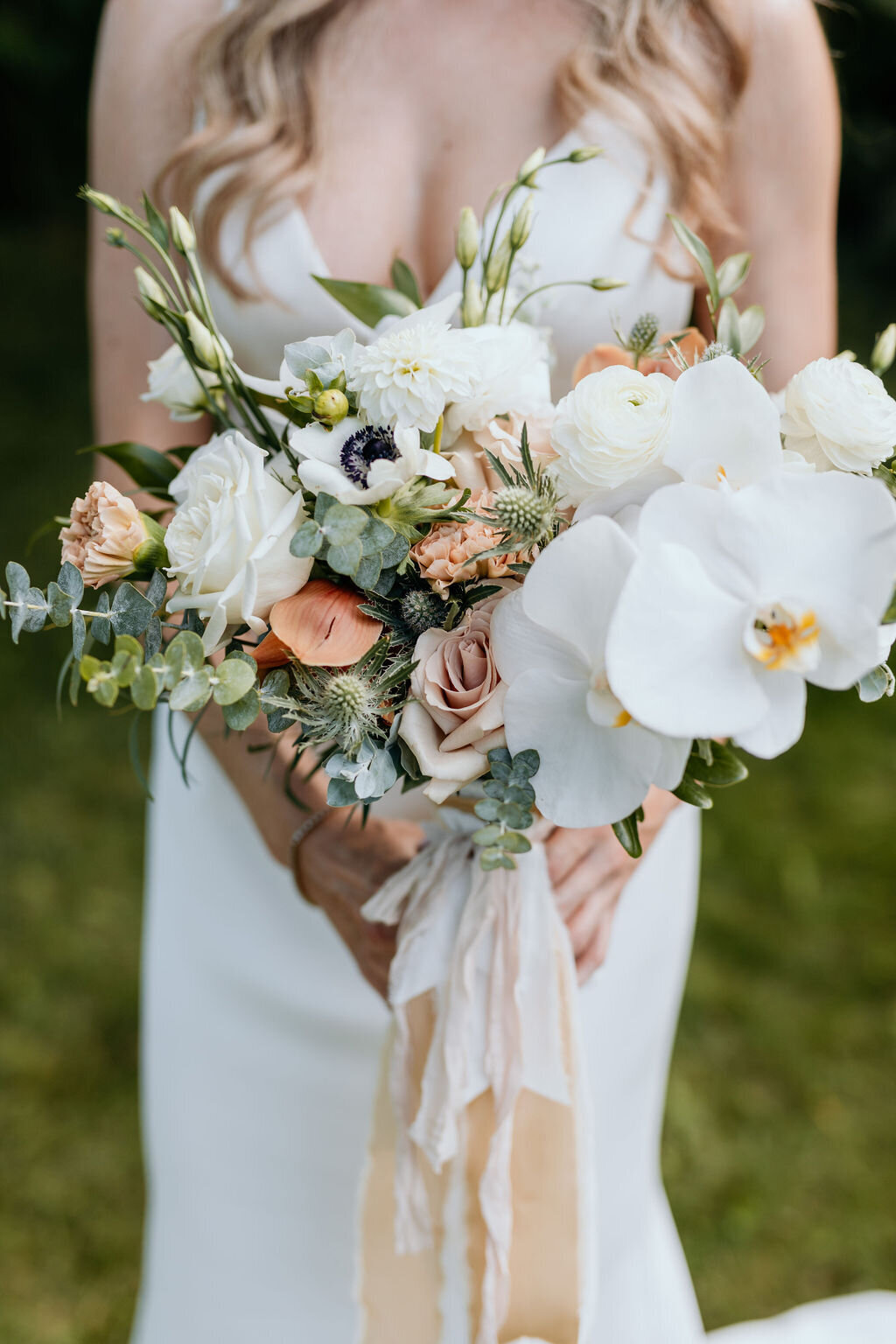 Stunning contemporary bridal bouquet held by modern bride.