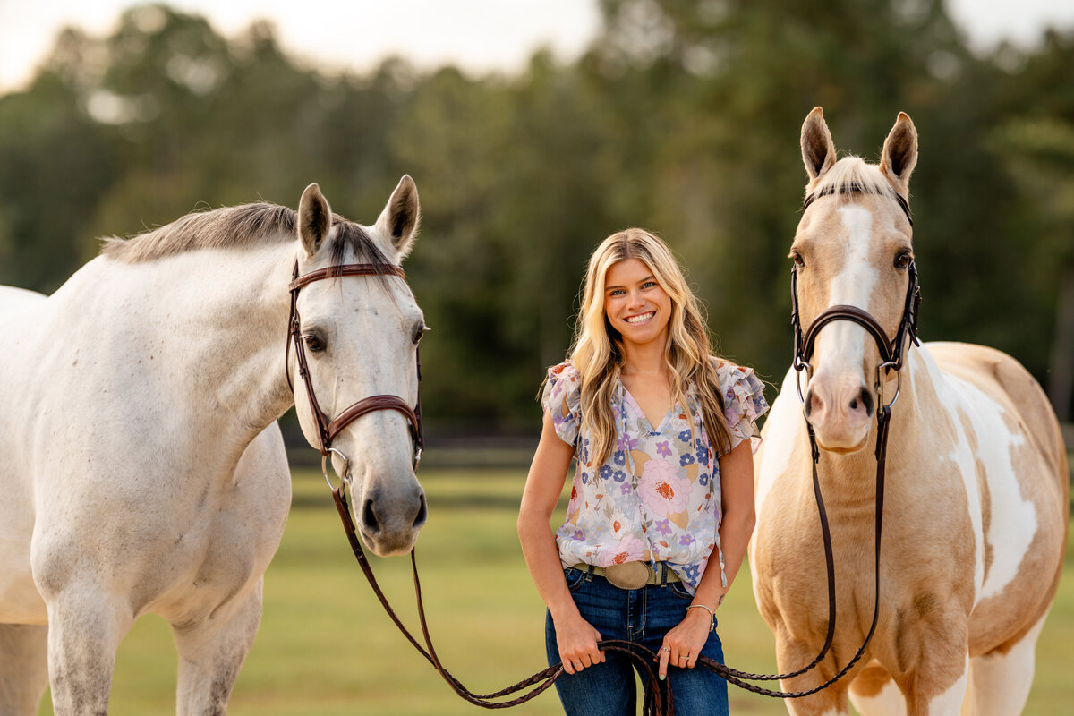 South alabama horse photographer takes pictures of woman with her two horses.