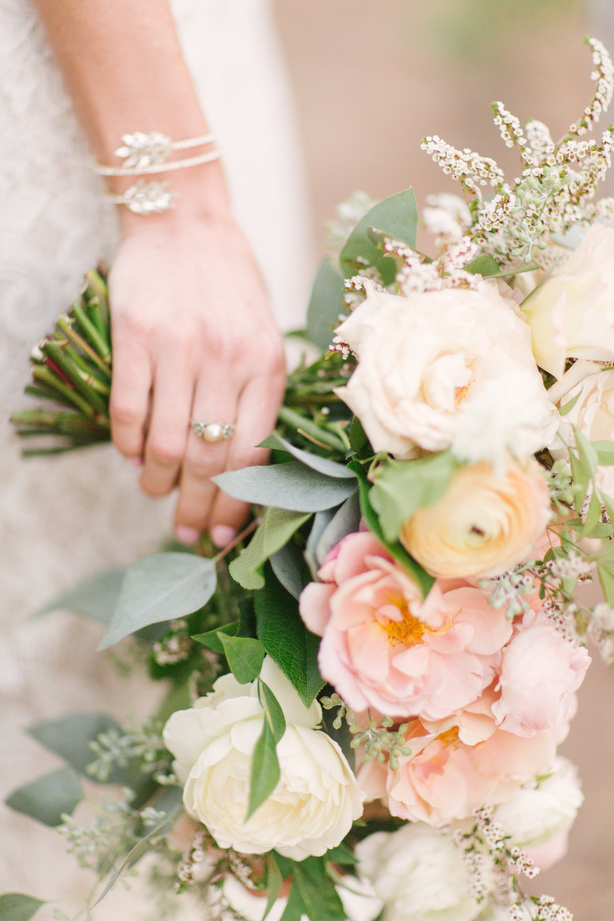 Brides jewelry and bouquet at Firestone Vineyard wedding
