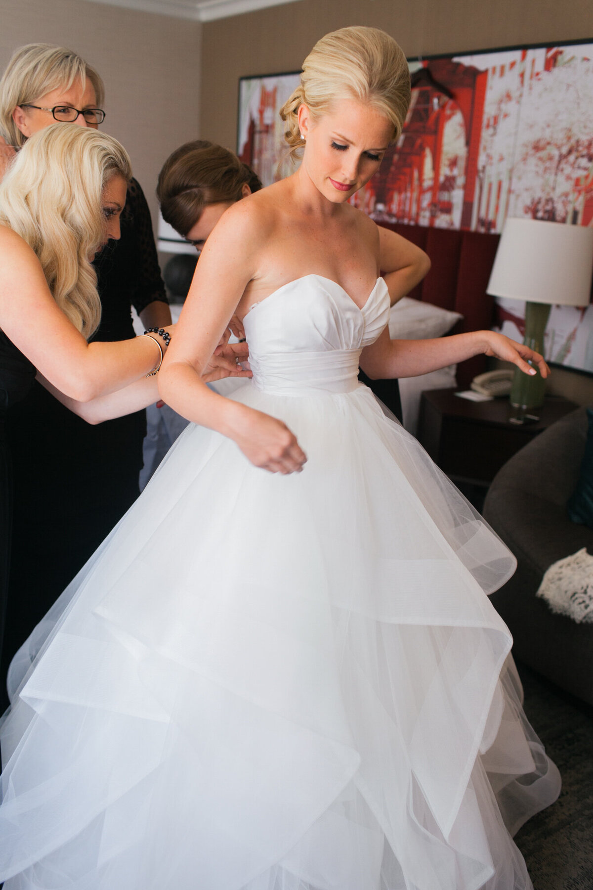 A bride dressed in Hayley Paige gets ready for her wedding day in Chicago