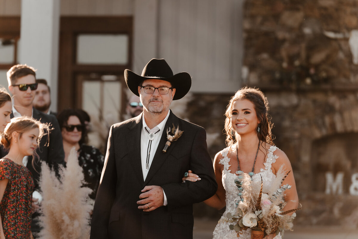 bride and father walk down aisle