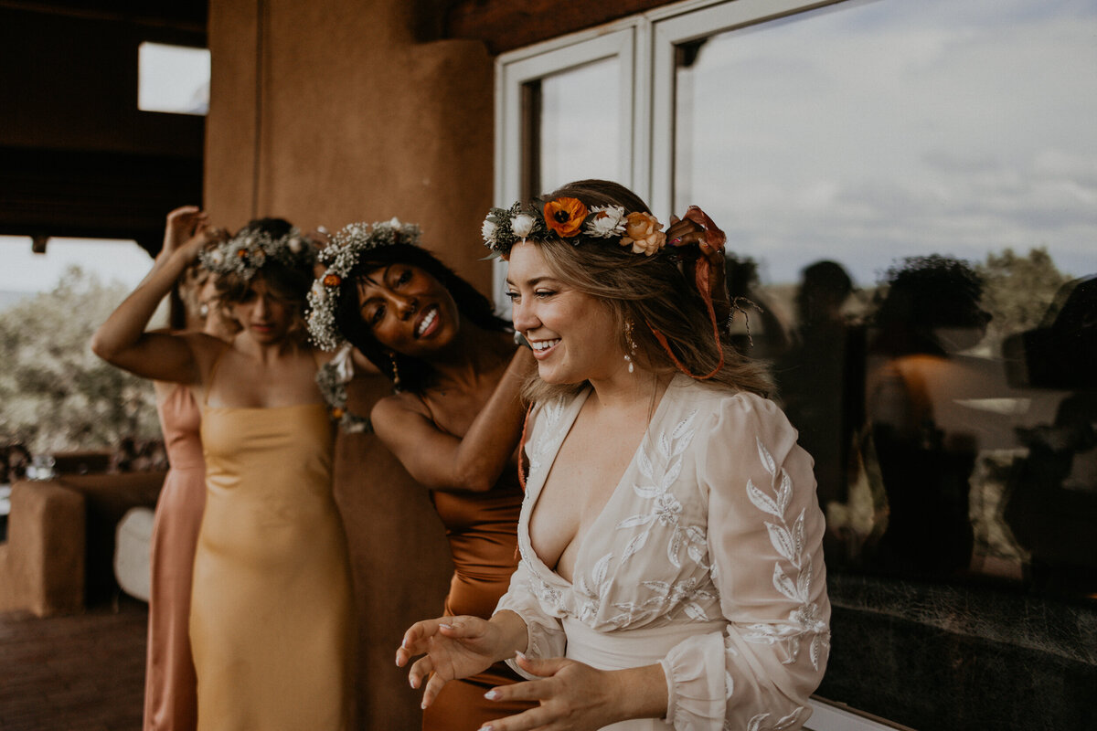 wedding party putting on flower crowns