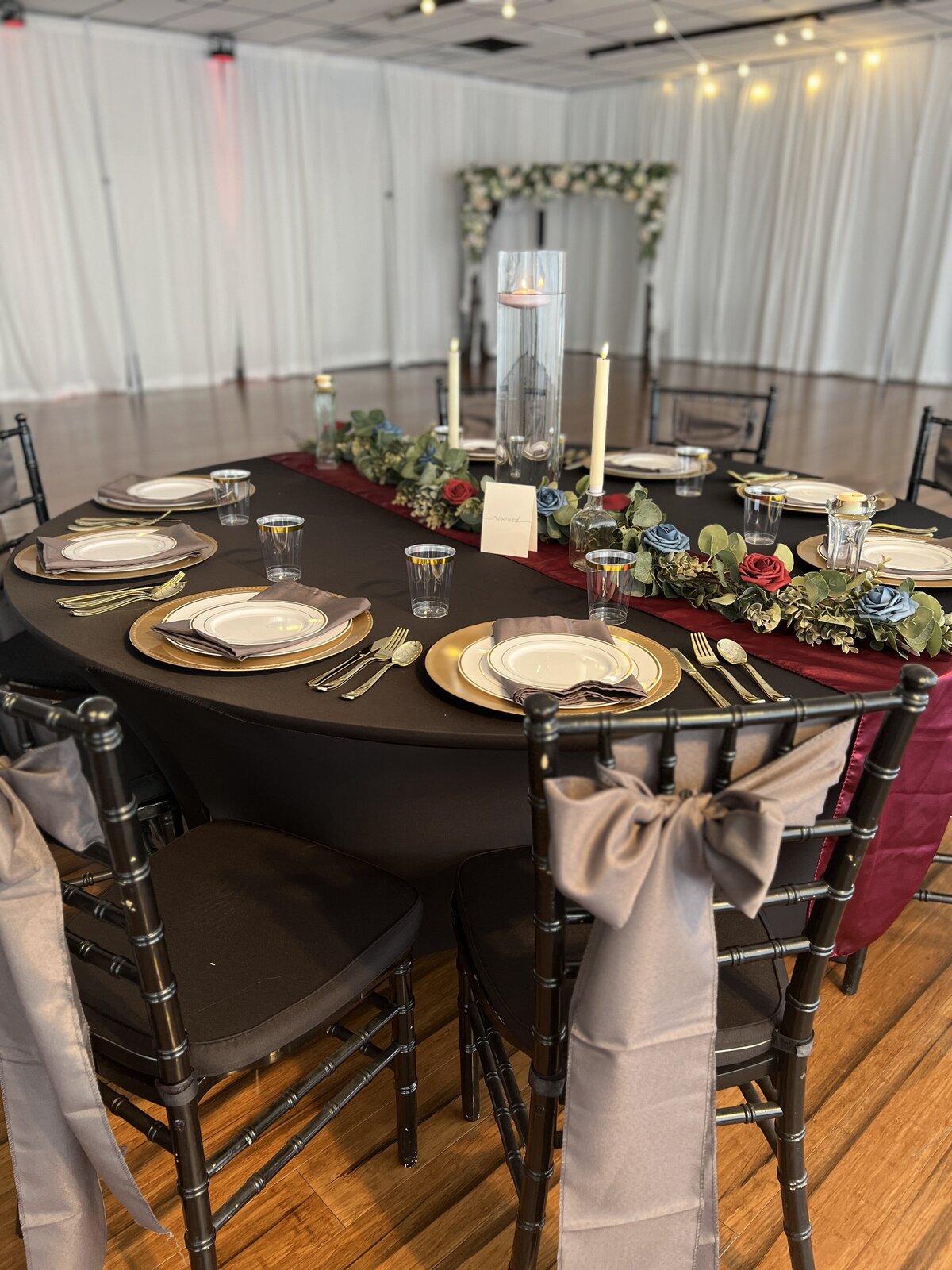 Moody wedding reception guest table with inclusive decor package at Clearwater, Florida event venue - Dark and dramatic ambiance for a memorable celebration