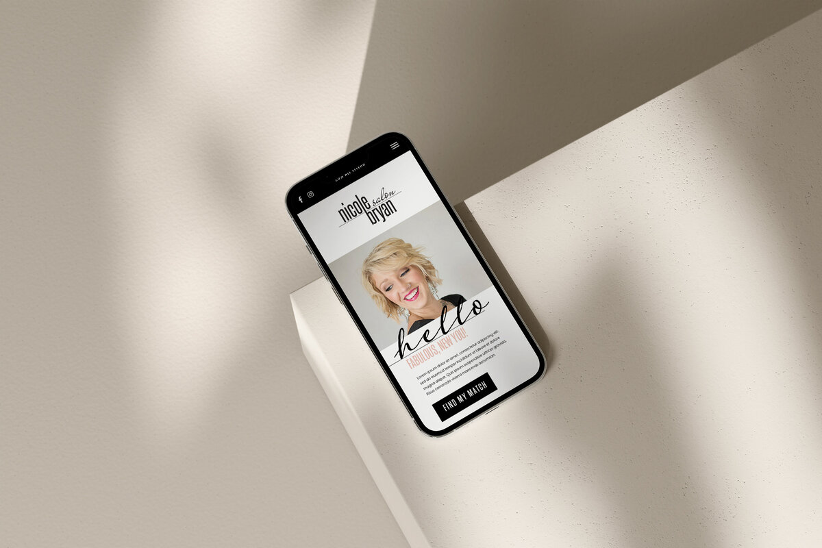 hair salon website design mocked up on a phone