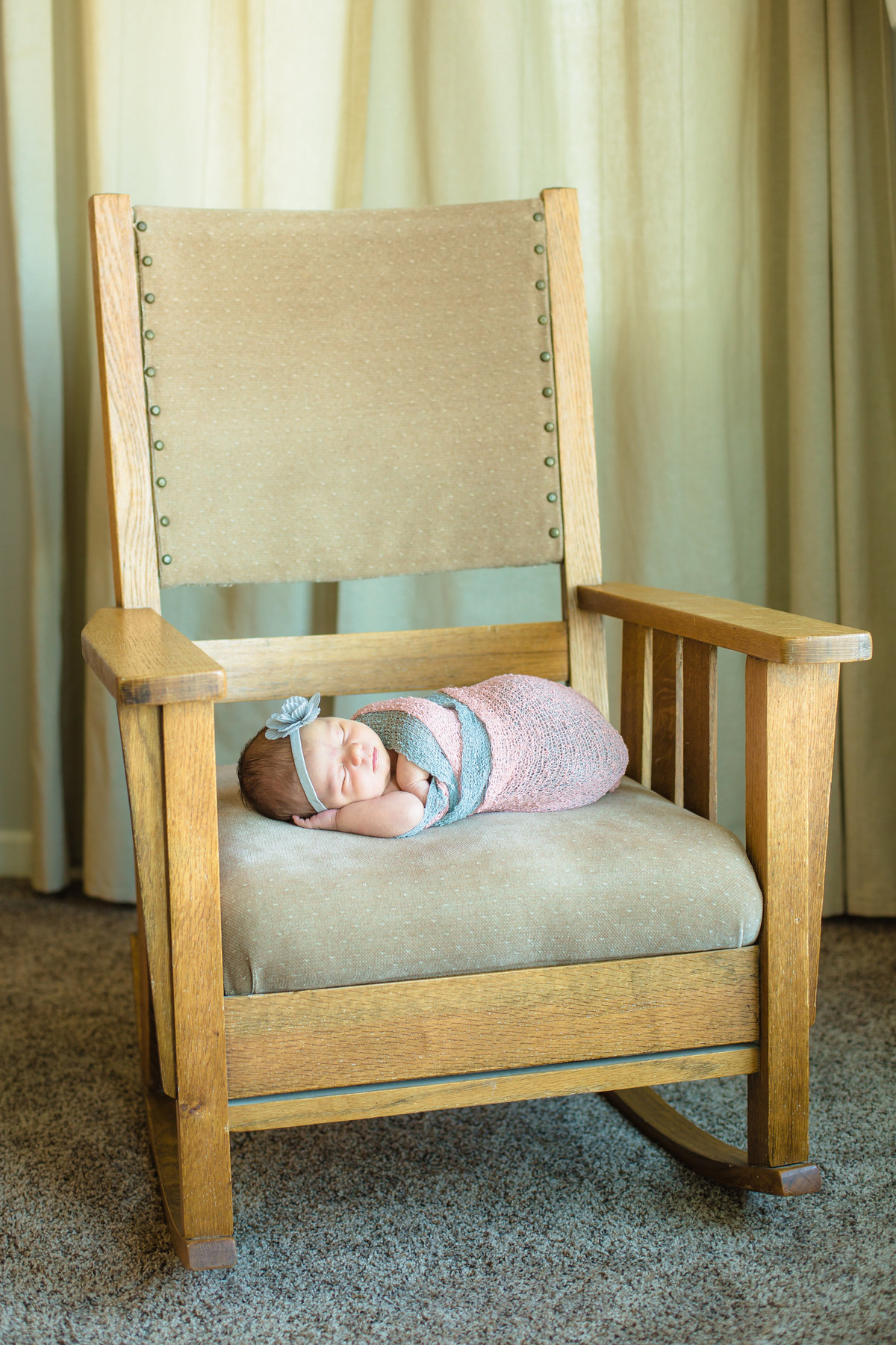 Newborn baby on Great Grandma's rocking chair