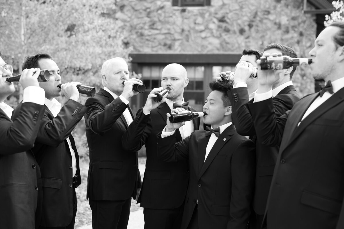 Groomsmen cheers at Colorado wedding