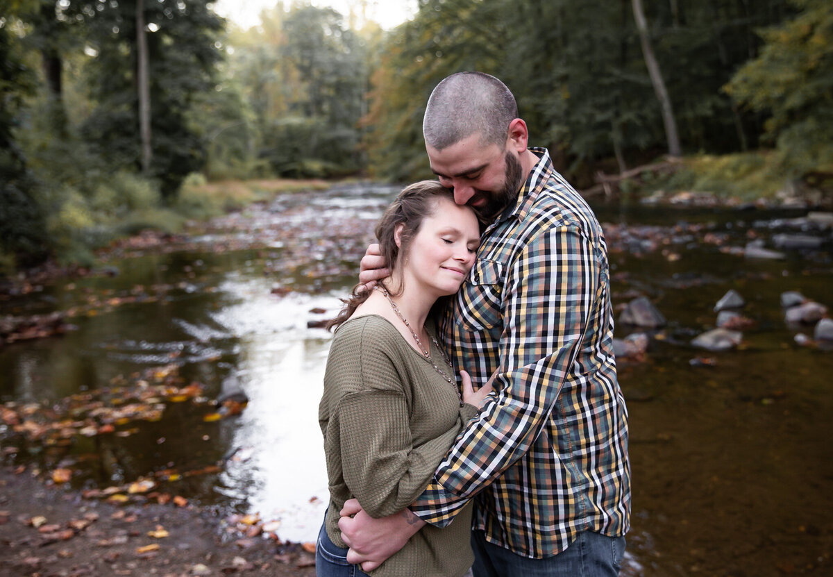 A couple embraces during their couples session in Harford County, Maryland