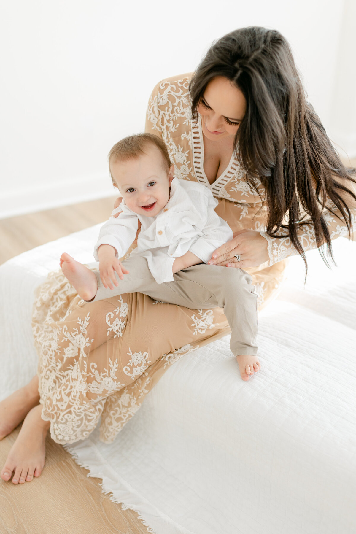 Mom tickling her toddler son photographed by Philadelphia Portrait Photographer Tara Federico