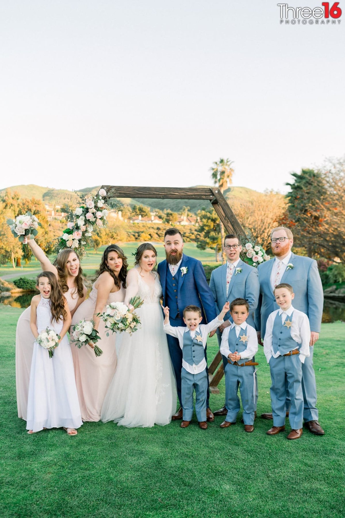 Bride and Groom pose with their bridal party kids included