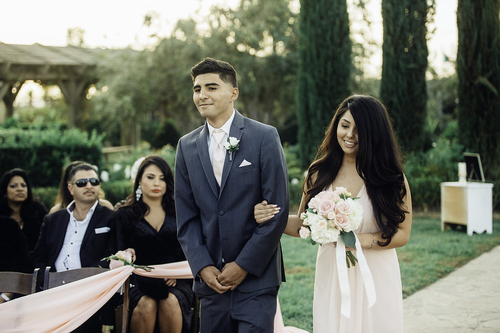 Wedding Photograph Of Bridesmaid Holding The Groomsman Los Angeles