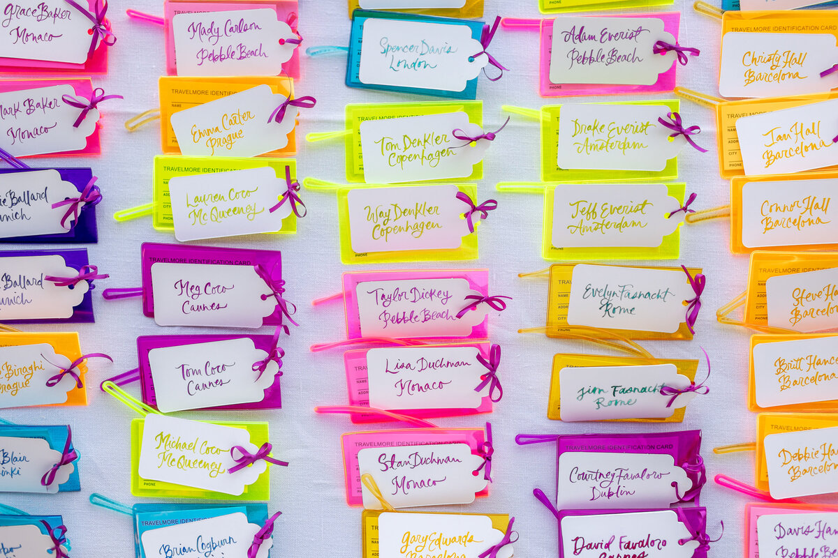 Bright and colorful luggage tag escort cards