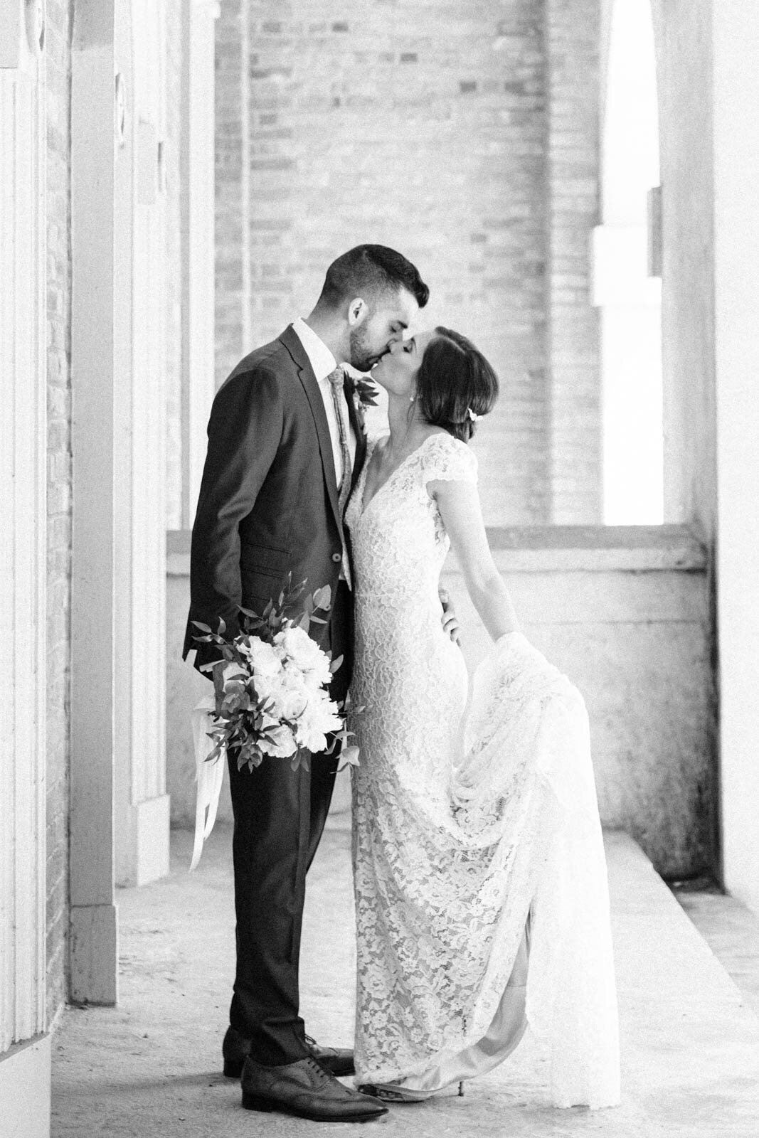 Bride and groom kiss romantically captured by Calgary's luxury photographer