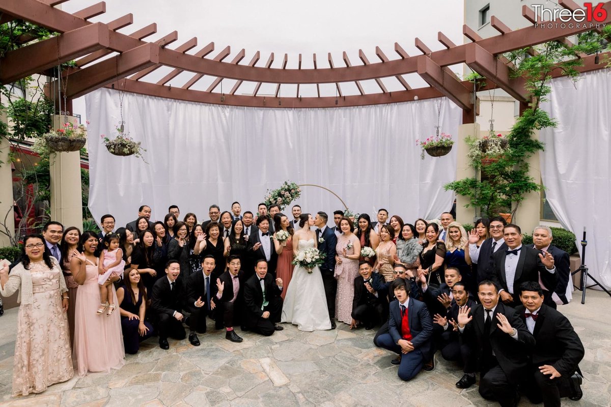 Large group photo at the NOOR wedding venue