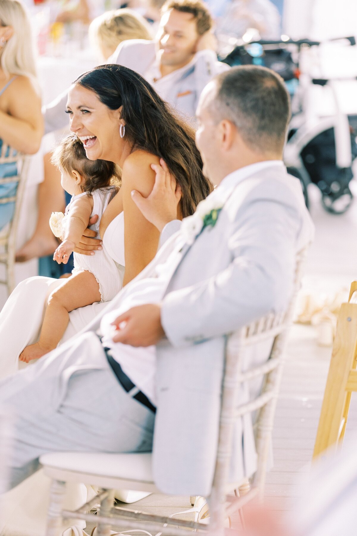 Bride and groom laughing at ceception
