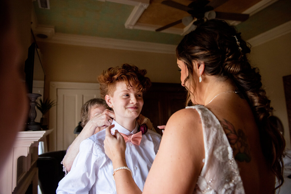 Mother looks at child during wedding
