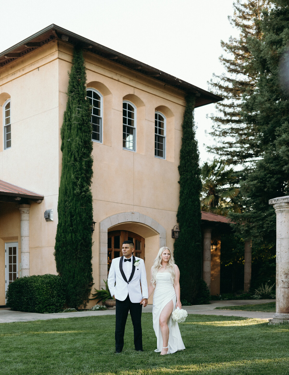 Couple stands infront of Architecture at Trentadue Winery