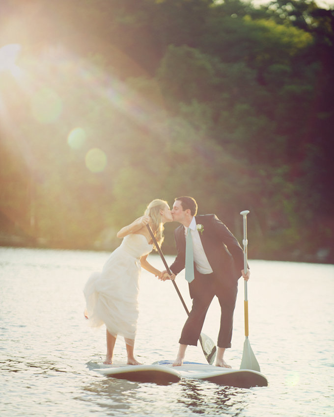 Bride and groom on paddle boards