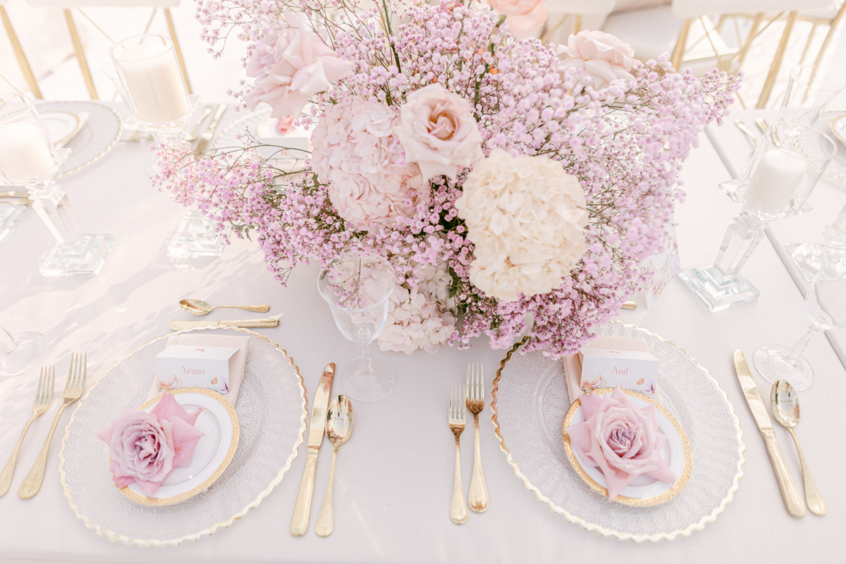 outdoor-reception-pink-purple-gold-chargers-flatware