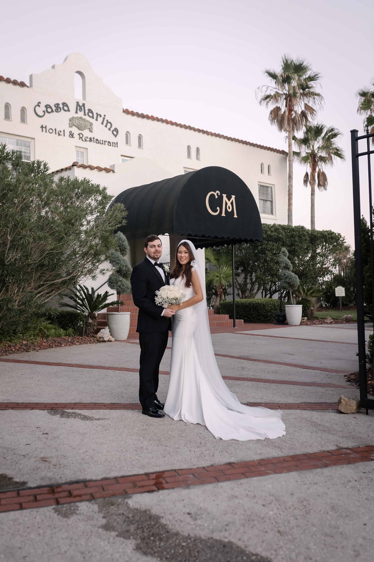 Bride and Groom in front of Casa Marina, Jacksonville FL | Jacksonville Wedding Photography - Phavy Photography