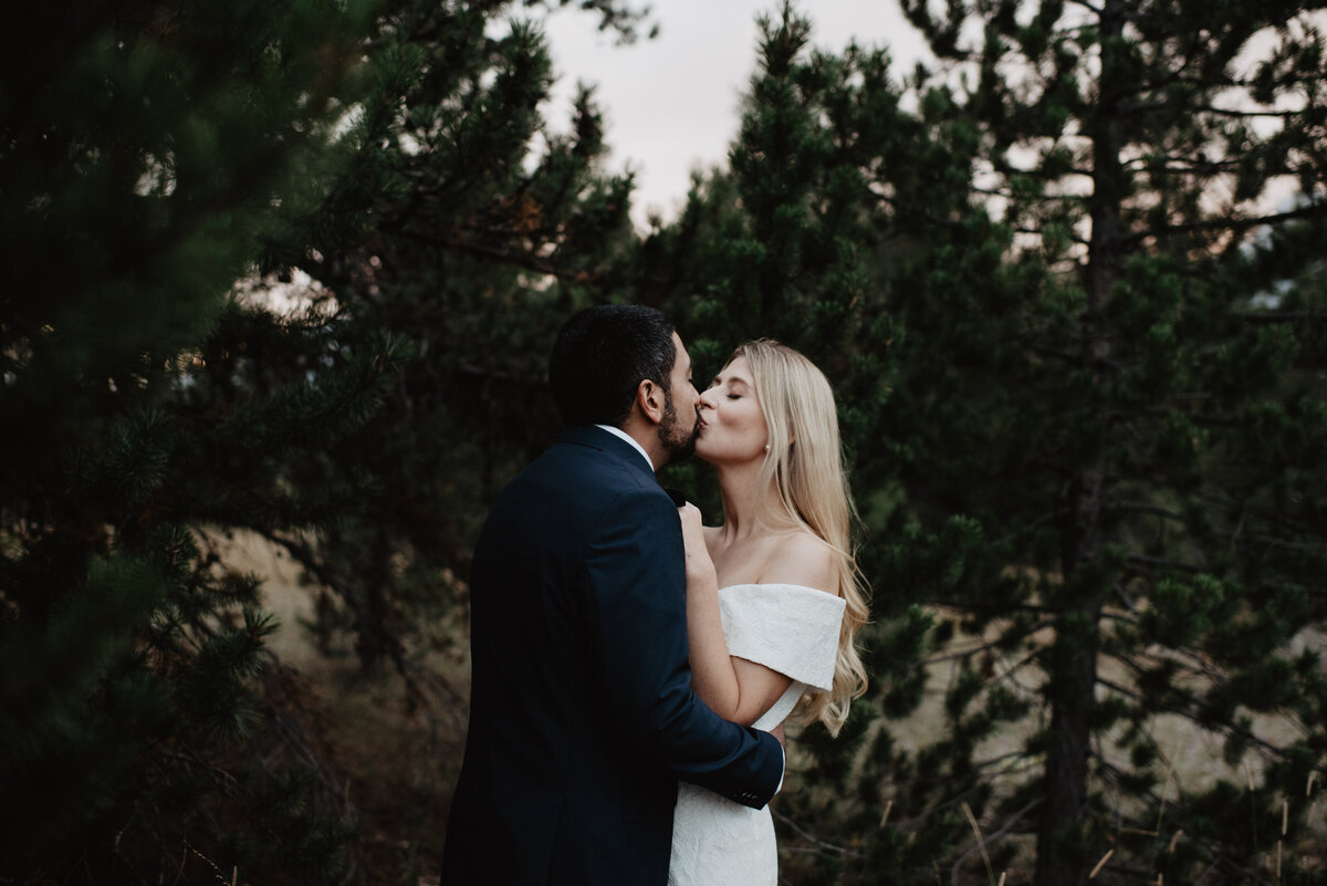 Photographers Jackson Hole capture bride and groom kissing