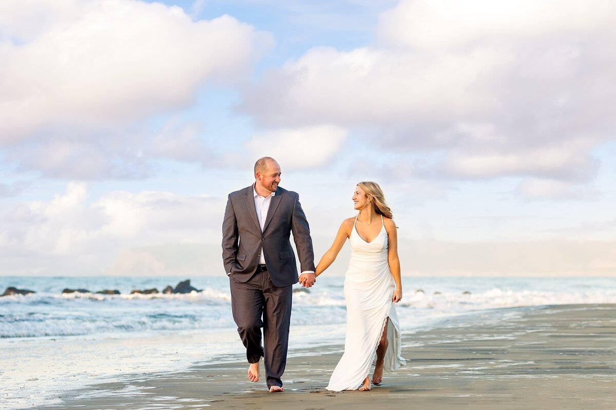 Wedding couple walking along the beach in Coronado