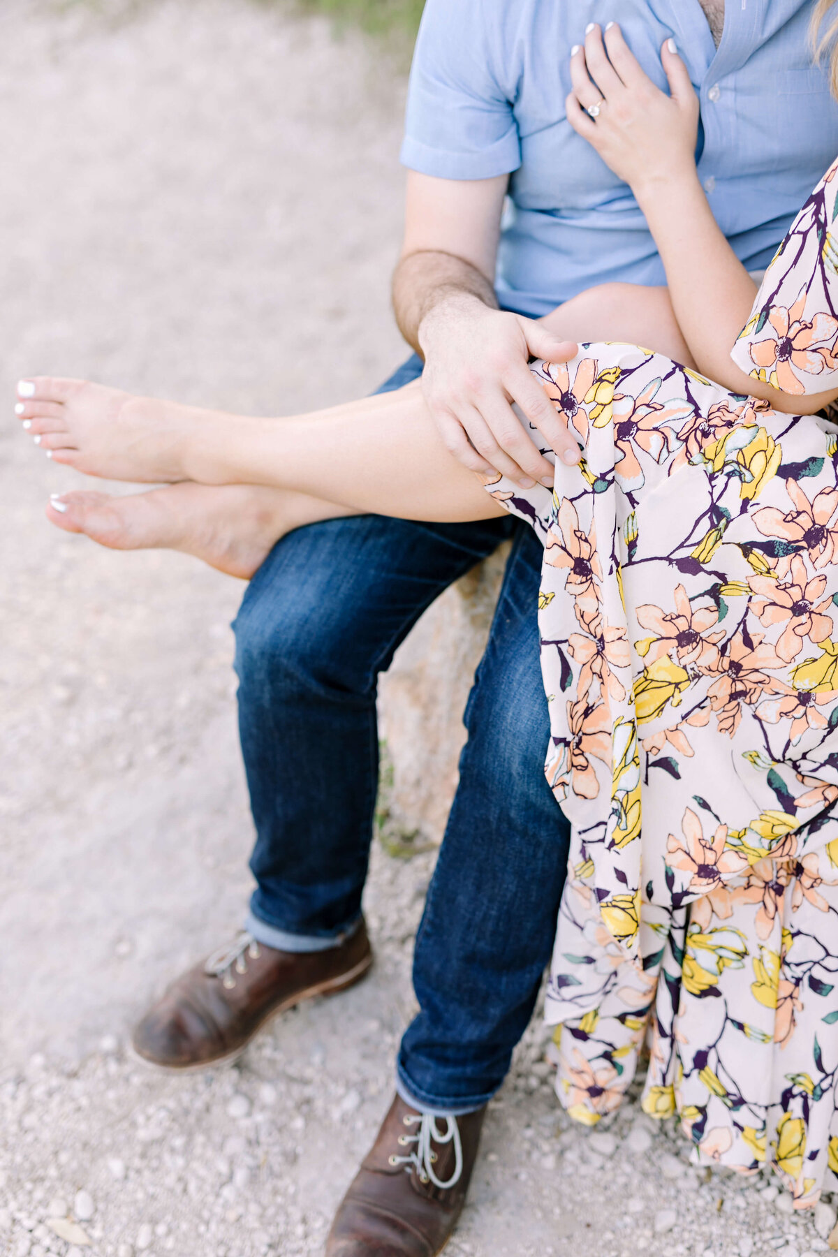 Women wearing a floral dress for her engagement session in Austin, Texas
