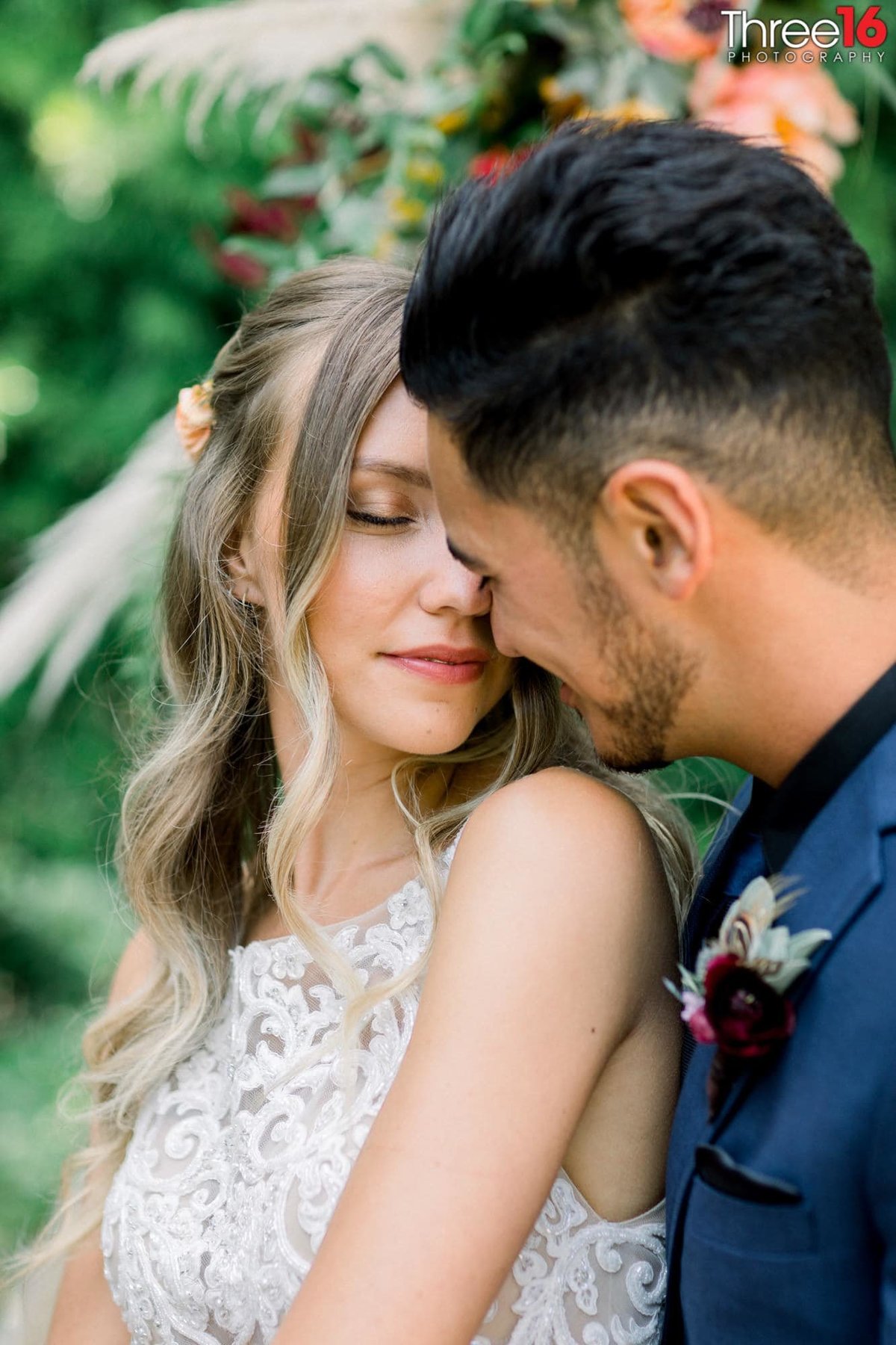 Sweet tender moment between Bride and Groom as they cozy up to each other
