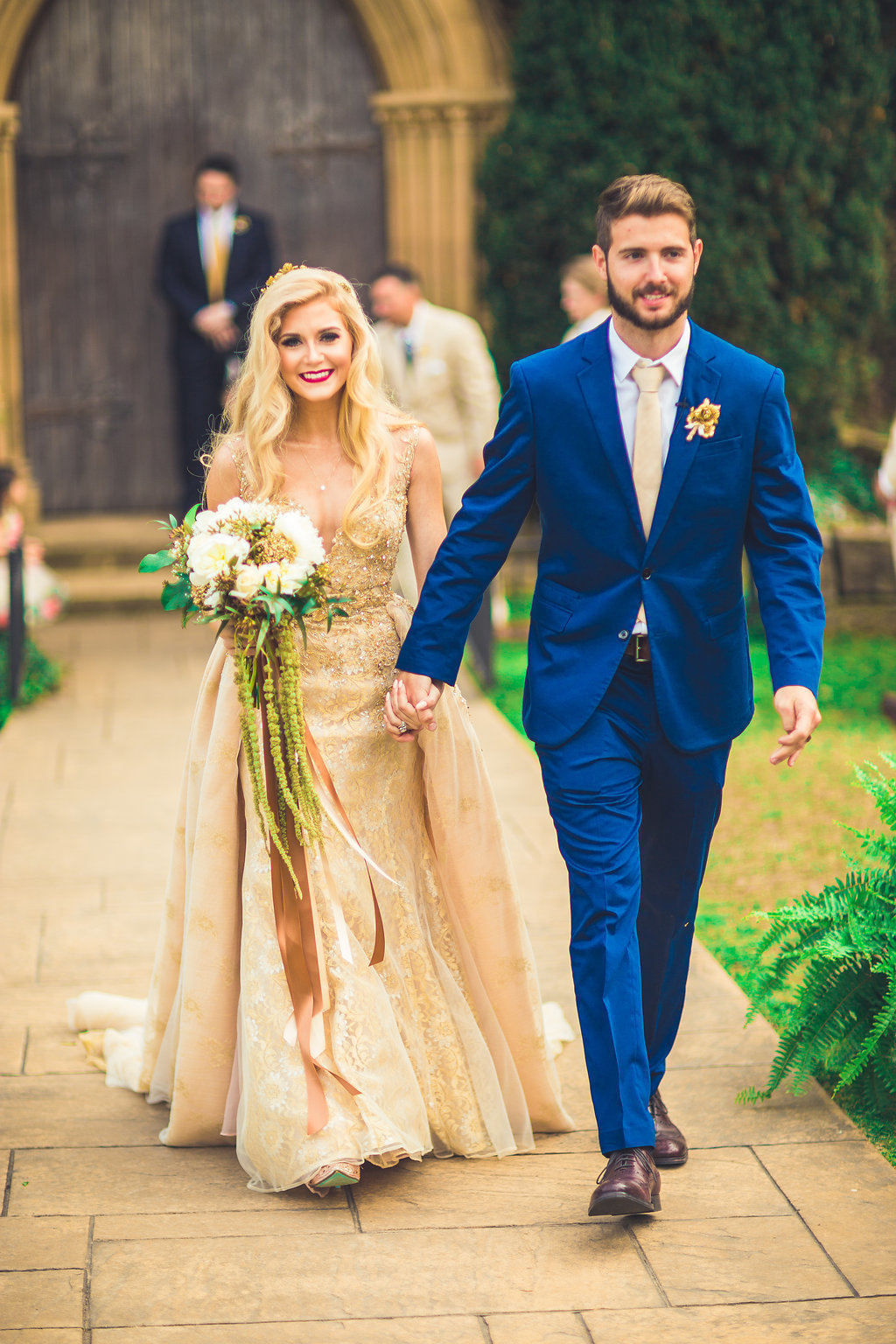 Wedding Photograph Of Bride and Groom Holding Hands While Walking Down the Aisle Los Angeles