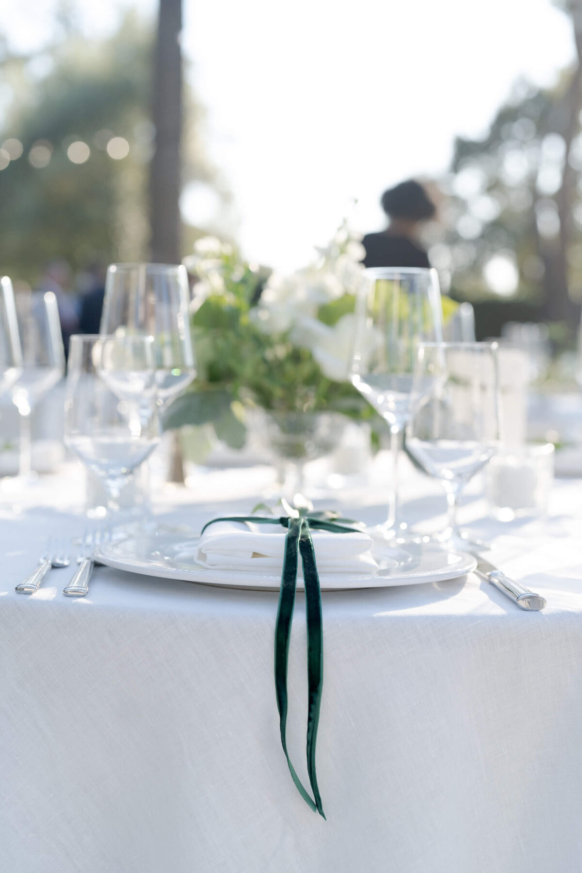 Classy glasses and table arrangements for a wedding.