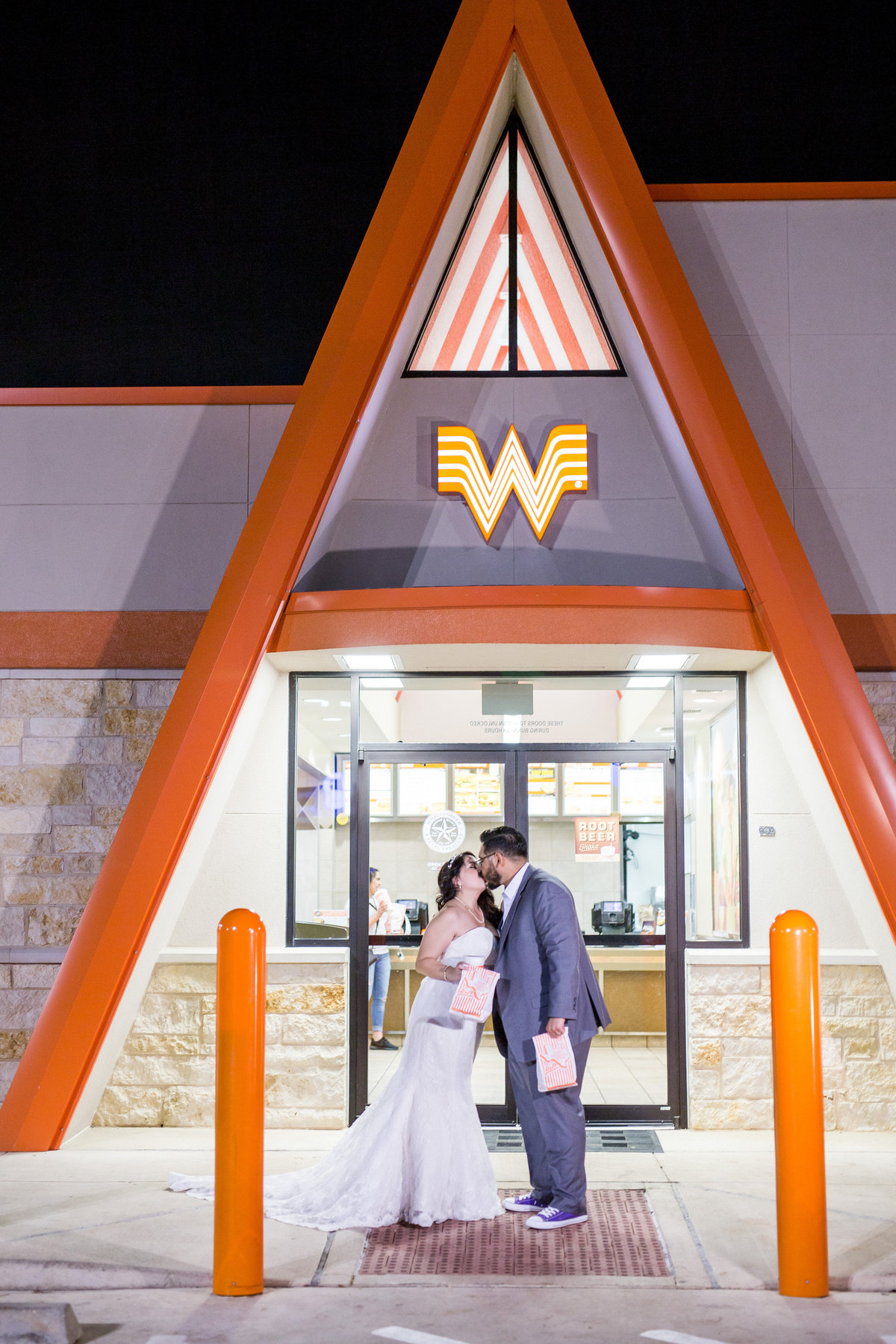 bride and groom get food at Whataburger after wedding reception