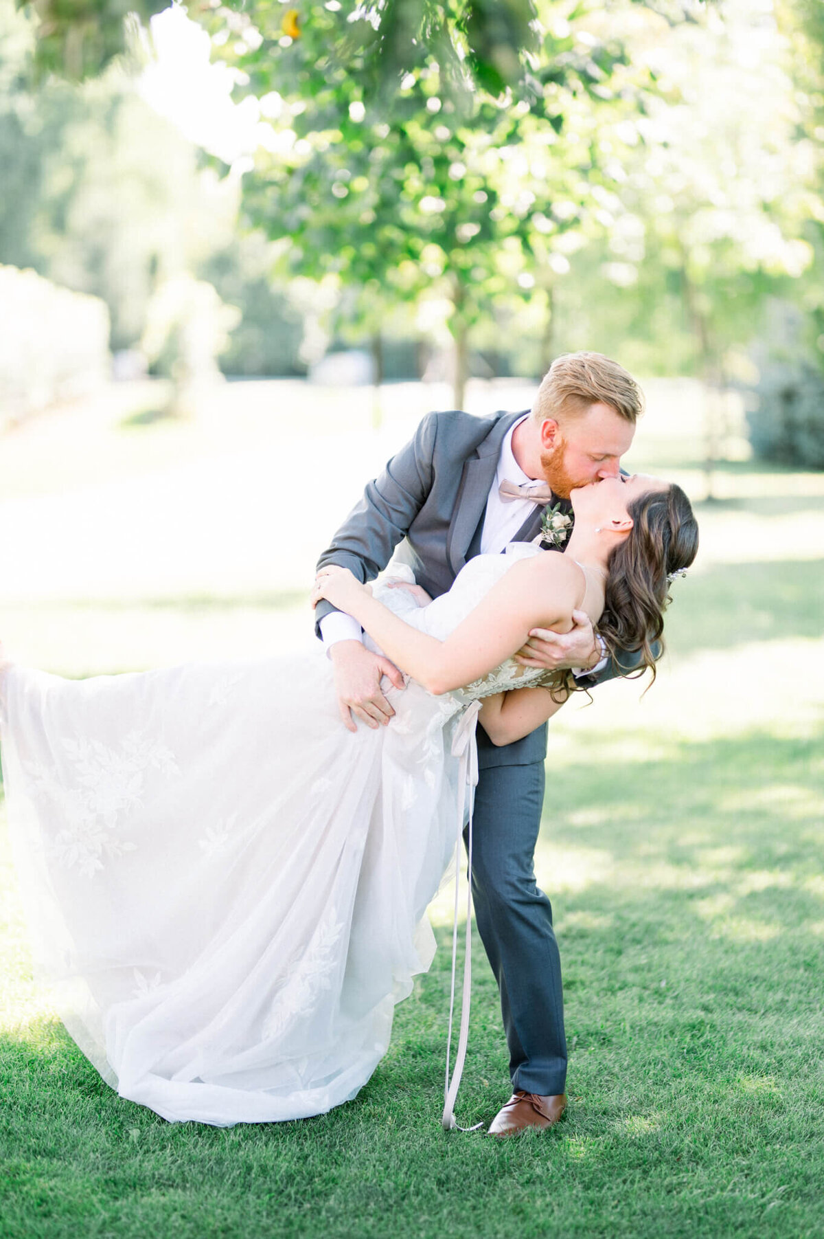 Groom dips bride for Toronto wedding photographer