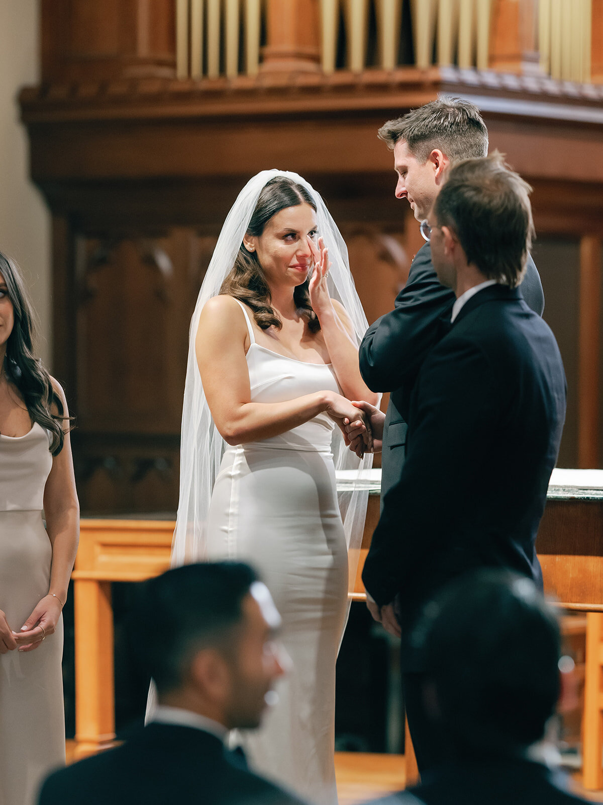 Bride sheds tears as they exchange vows at Dahlgren Chapel