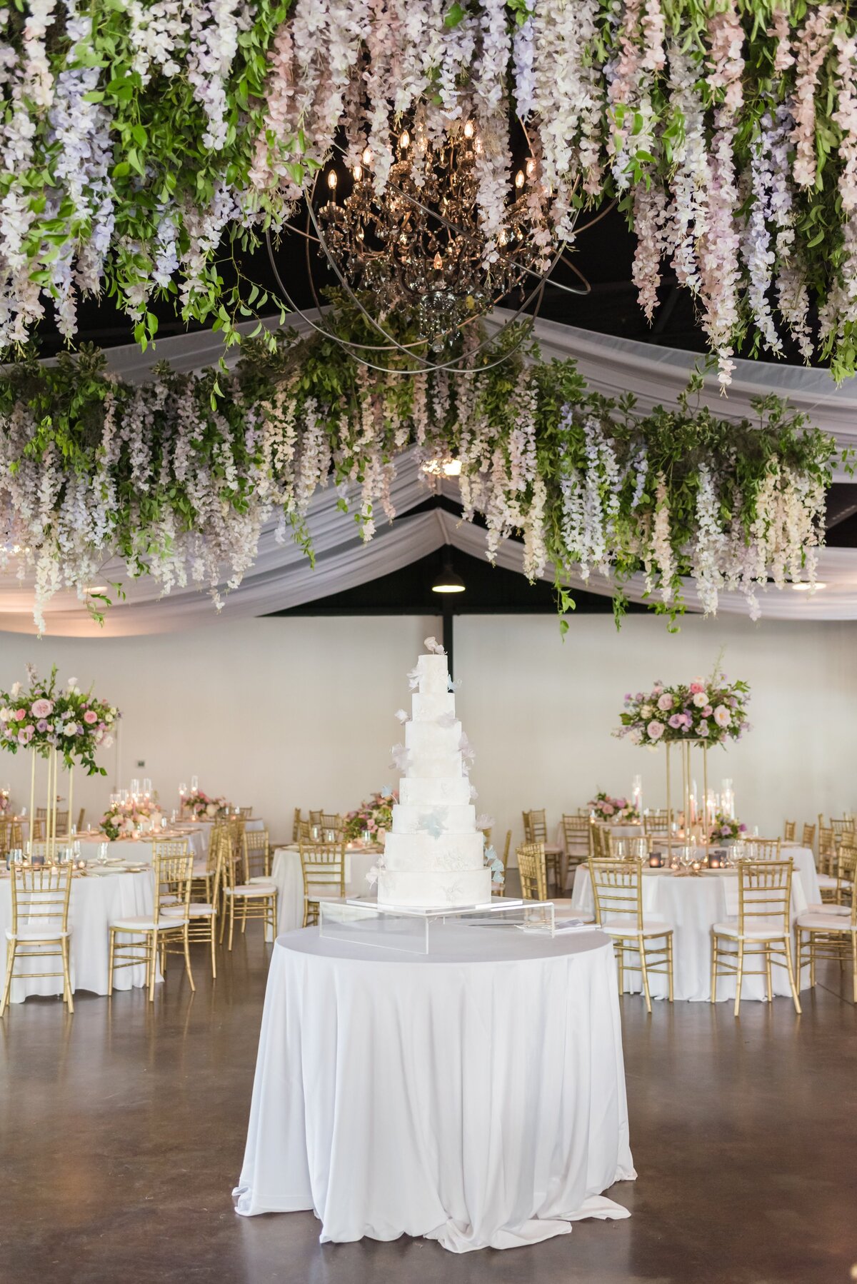 Tiered wedding cake hanging florals The Estate at Cherokee Dock