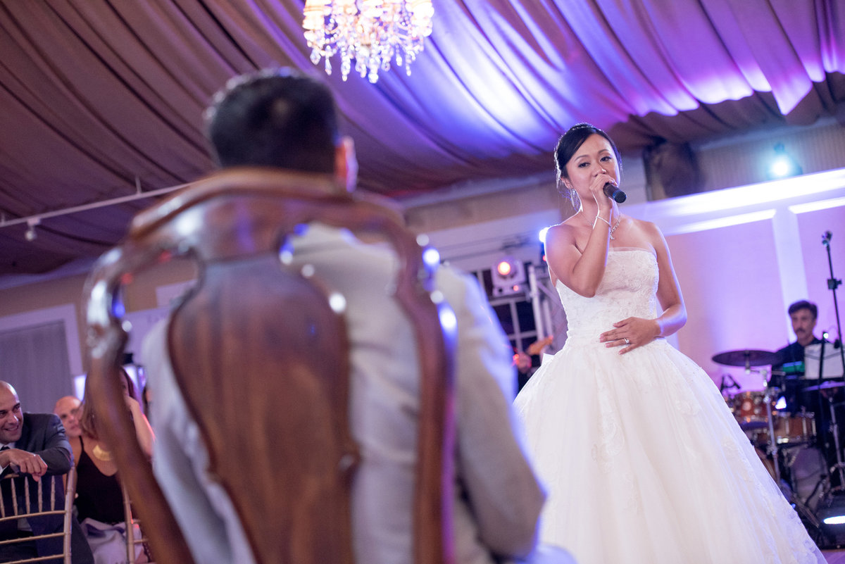 Bride singing to her groom at Bridgeview Yacht Club