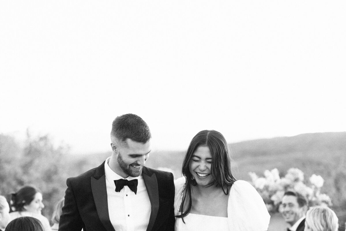 black-and-white-of-bride-and-groom-laughing