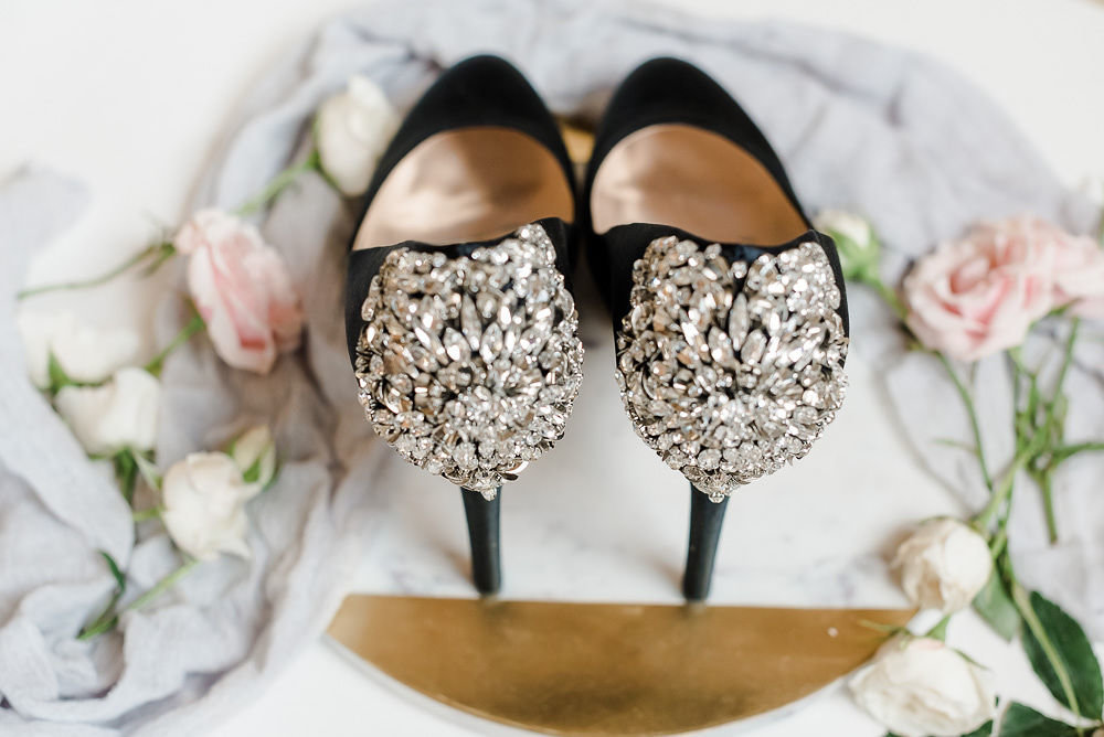 A close-up photo of the bride's black shoes by Brooke Kristine Photography