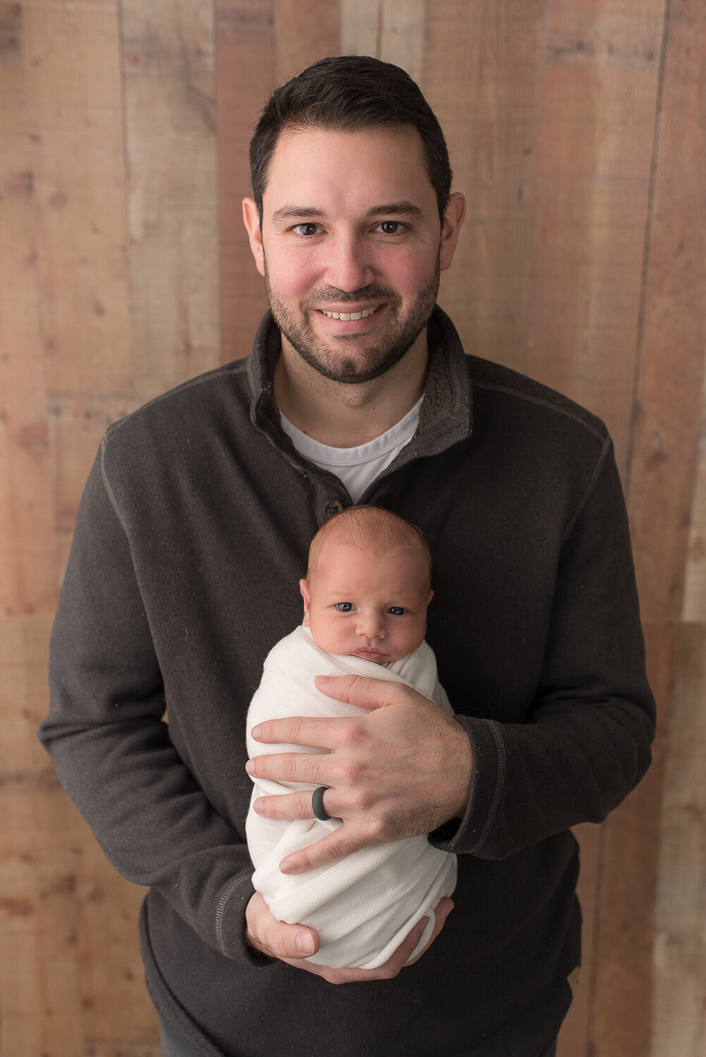 Father holding son at newborn session in Canton, CT |Sharon Leger Photography | Canton, CT Newborn & Family Photographer