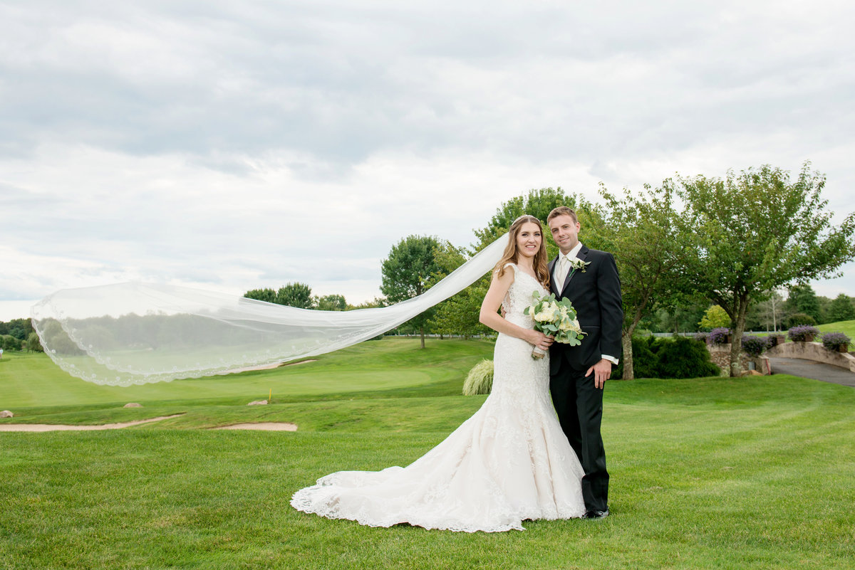 wide shot of bride and groom on the golf course at Willow Creek Golf and Country Club wedding