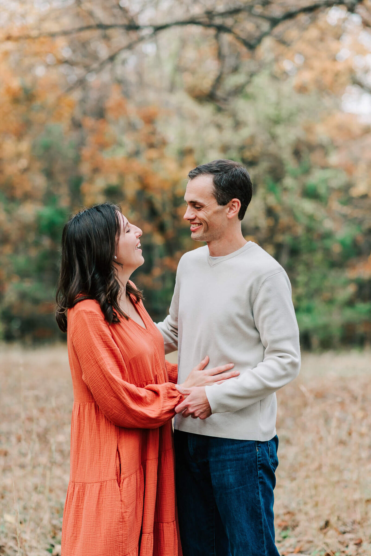 A couple laughing together during their family photography session in Northern Virginia