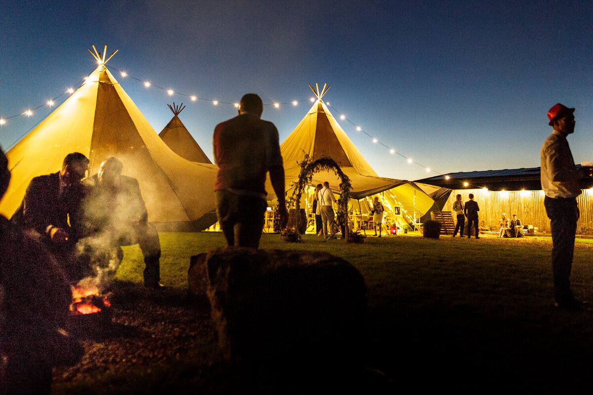 guests chatting outside tipi