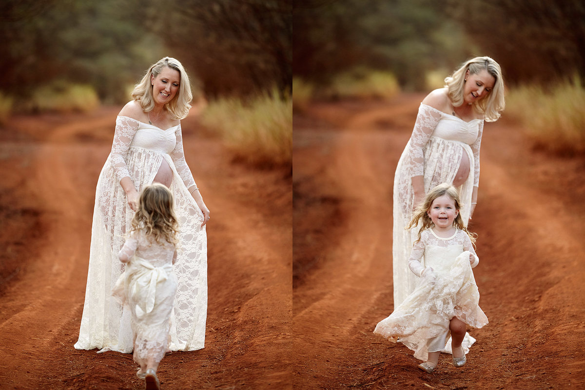 Pregnant mum with a matching white outfit to her daughter playing a game of hide and seek in her dress in a red dirt landscape